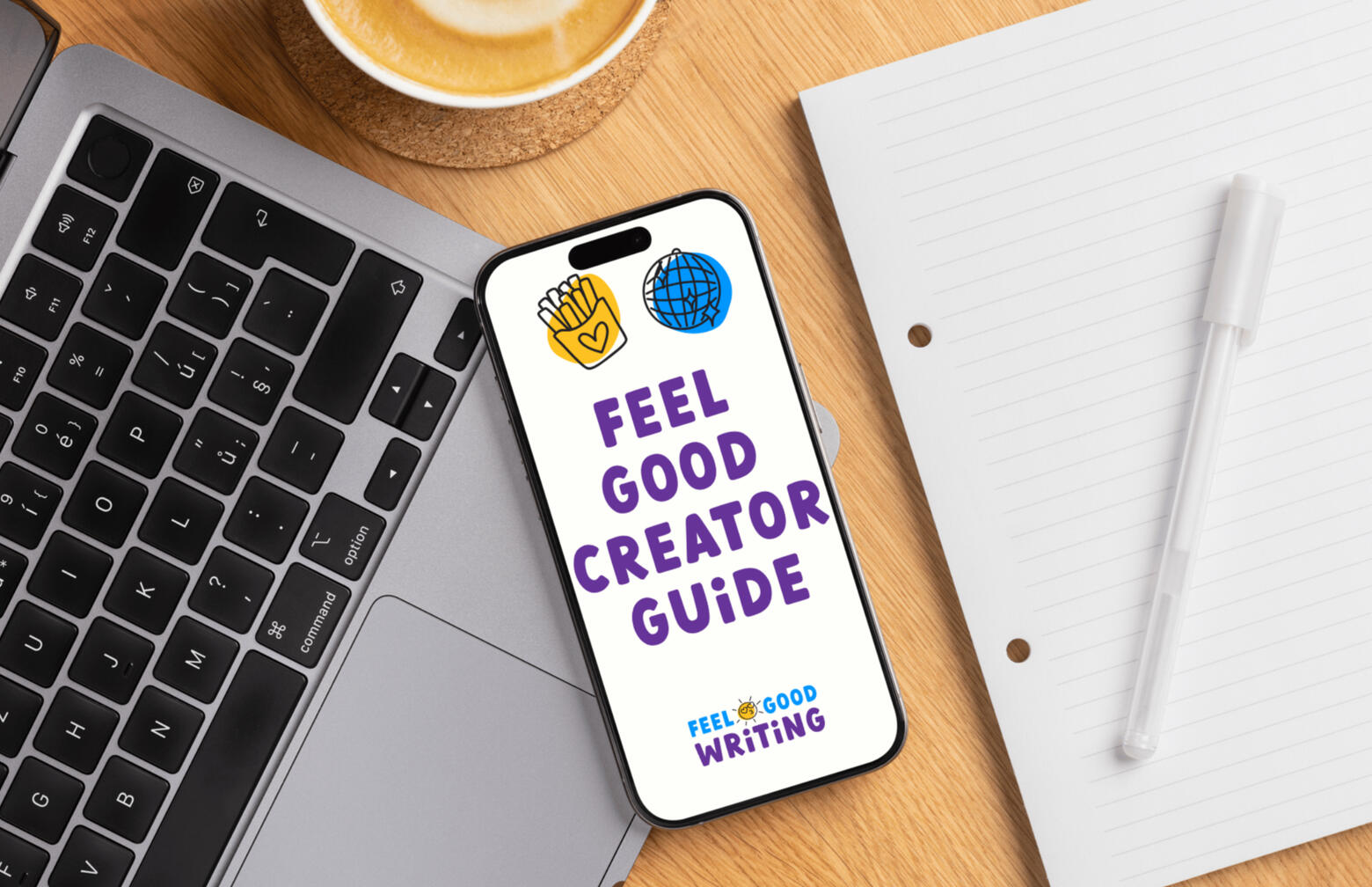Smartphone mit Feel Good Creator Guide und Logo auf Schreibtisch